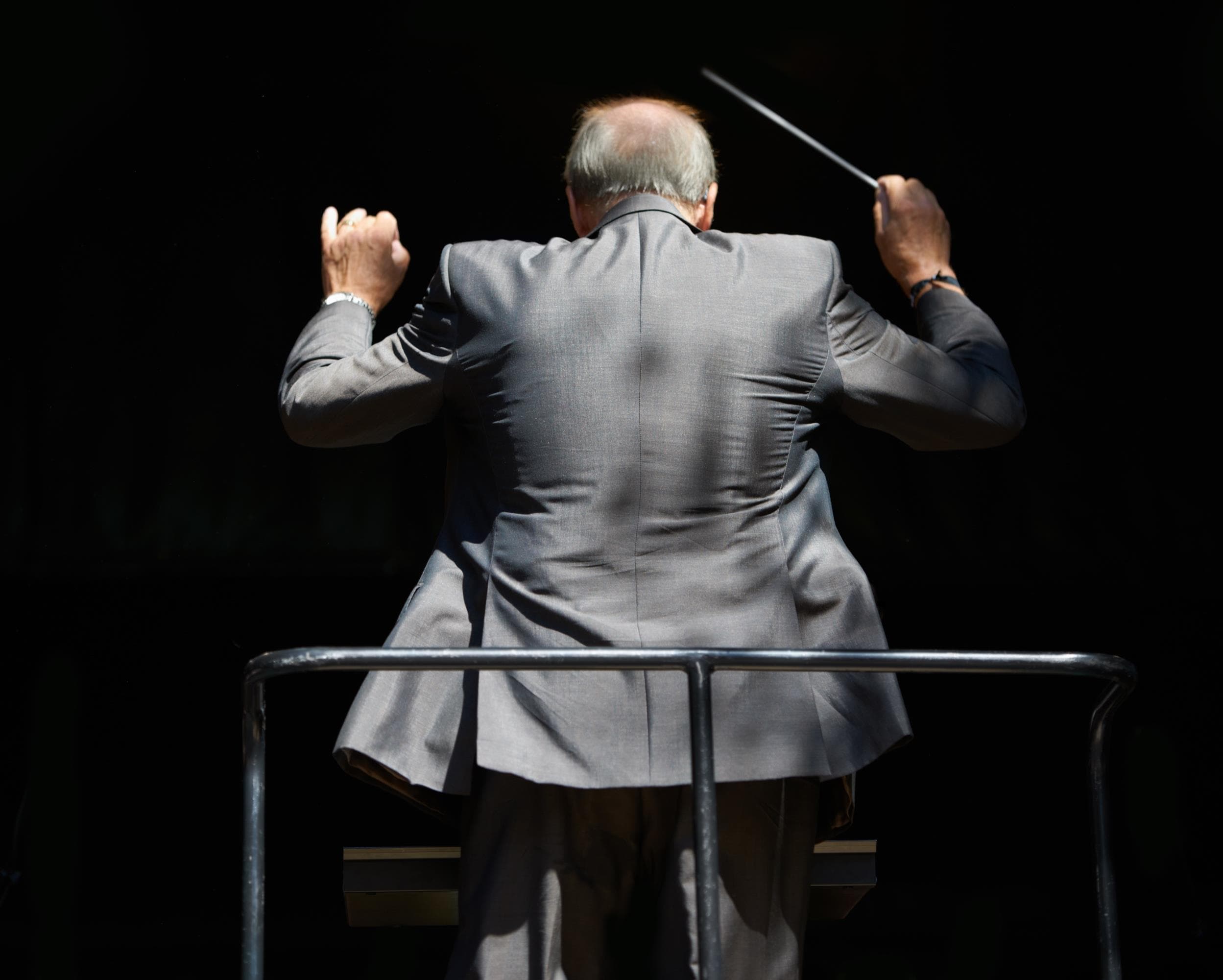 An educator conducting a musical ensemble