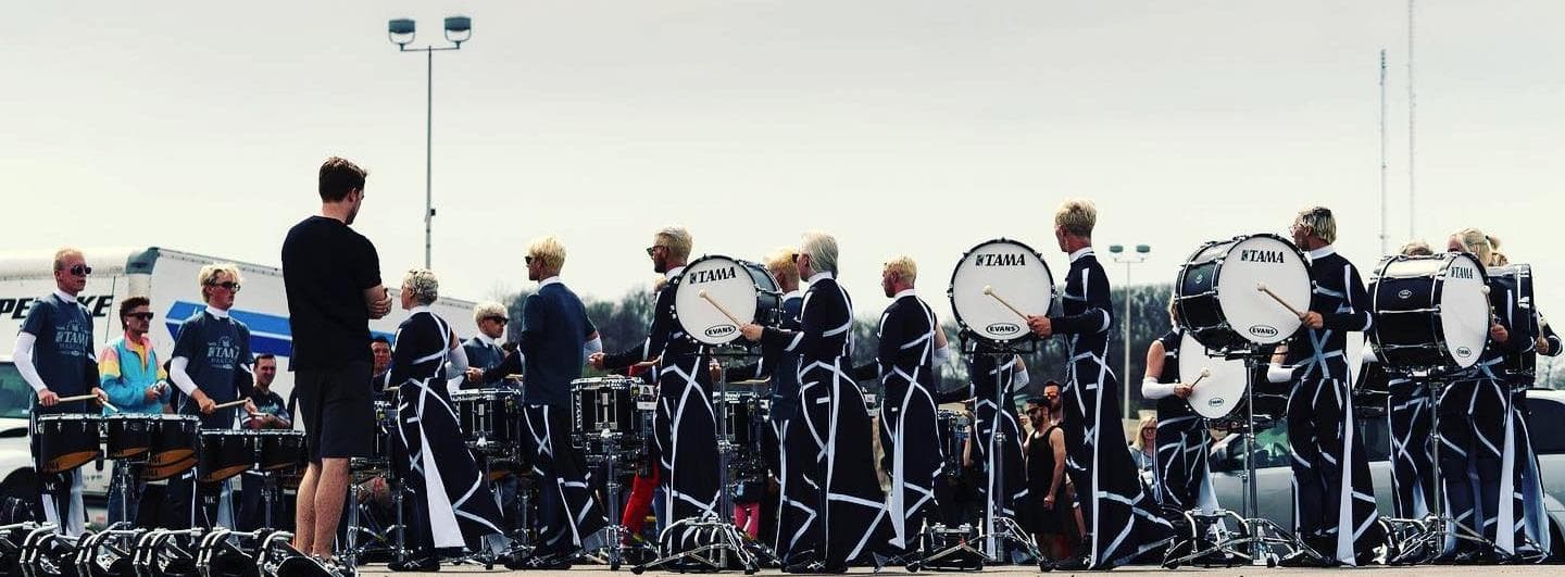 A youth percussion ensemble rehearsing outdoors